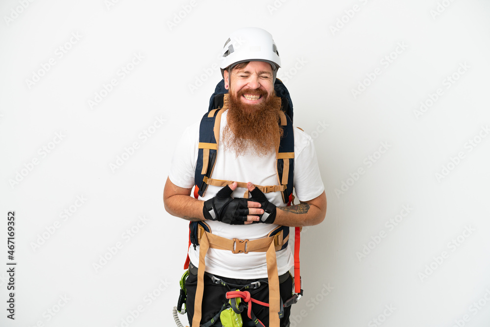 Young rock- climber reddish caucasian man isolated on white background smiling a lot Young rock- climber reddish caucasian man isolated on white background smiling a lot