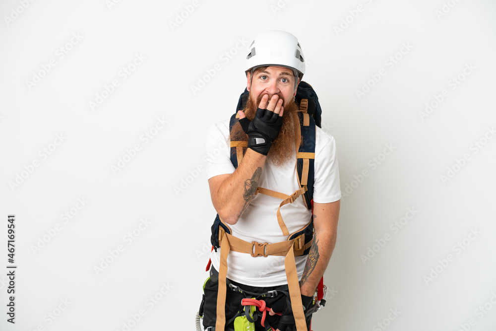Young rock- climber reddish caucasian man isolated on white background happy and smiling covering mouth with hand Young rock- climber reddish caucasian man isolated on white background happy and smiling covering mouth with hand