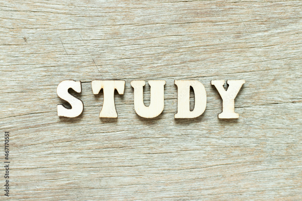 Alphabet letter in word study on wood background Alphabet letter in word study on wood background