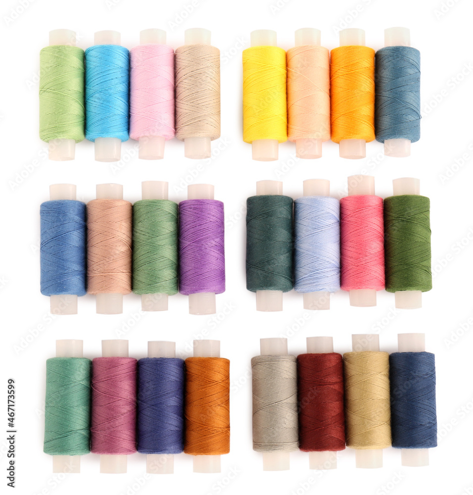 Set of colorful sewing threads on white background, top view Set of colorful sewing threads on white background, top view