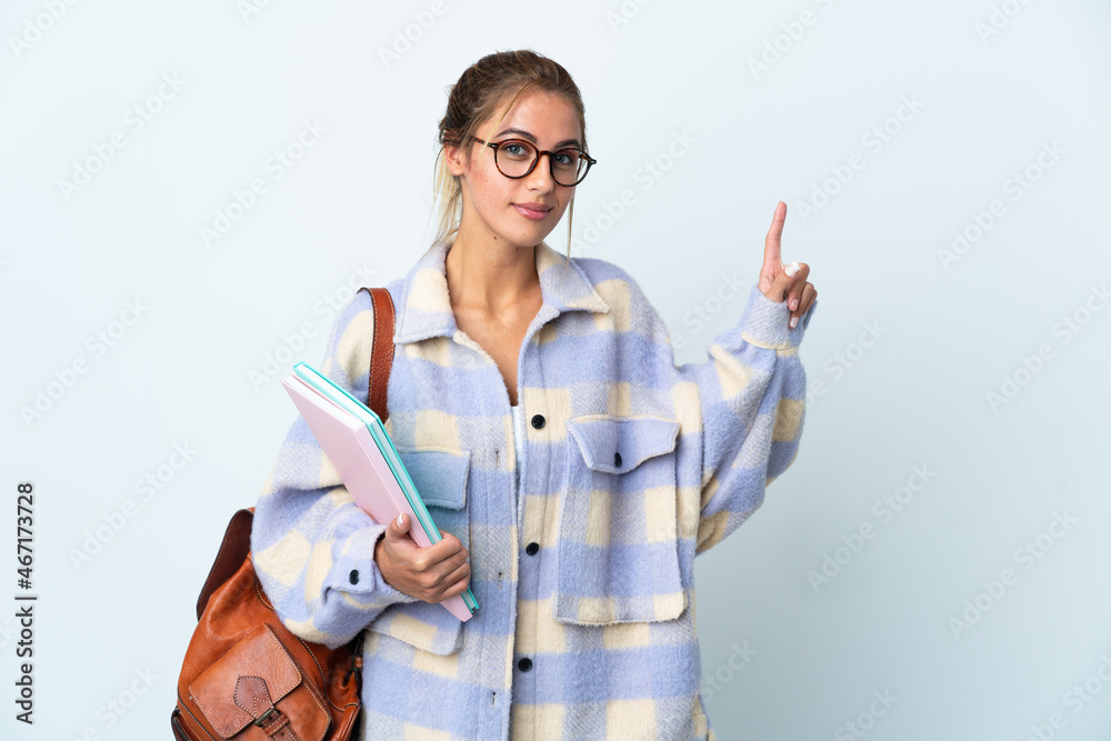 Young student woman isolated on white background showing and lifting a finger in sign of the best Young student woman isolated on white background showing and lifting a finger in sign of the best