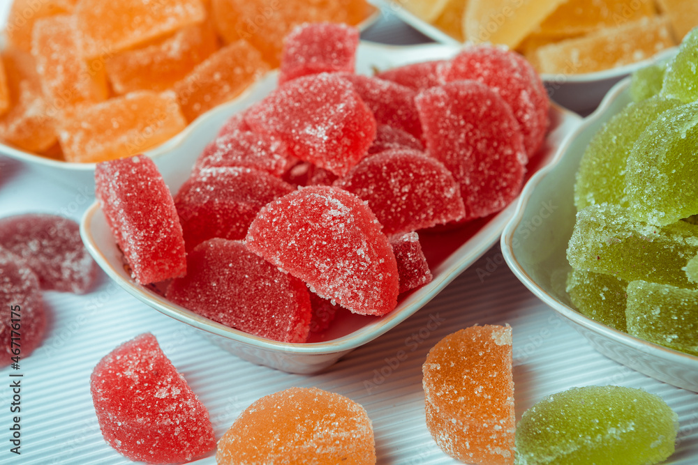 Dessert marmalade in the form of lemon and orange slices. The sweetness of jelly candy. Dessert marmalade in the form of lemon and orange slices. The sweetness of jelly candy.
