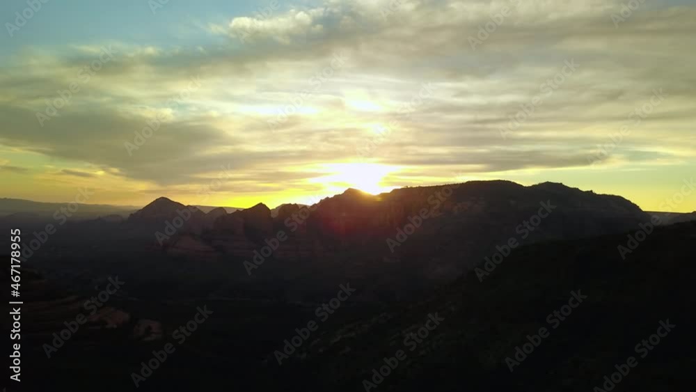 Aerial Scenic Shot Of Rock Formations Against Cloudy Sky During Sunset - Sedona, Arizona Aerial Scenic Shot Of Rock Formations Against Cloudy Sky During Sunset - Sedona, Arizona