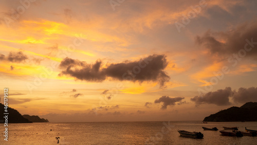 Nature landscape with colorful sunset and boats in the sea. Santa Marta, Magdalena, Colombia. © camaralucida1