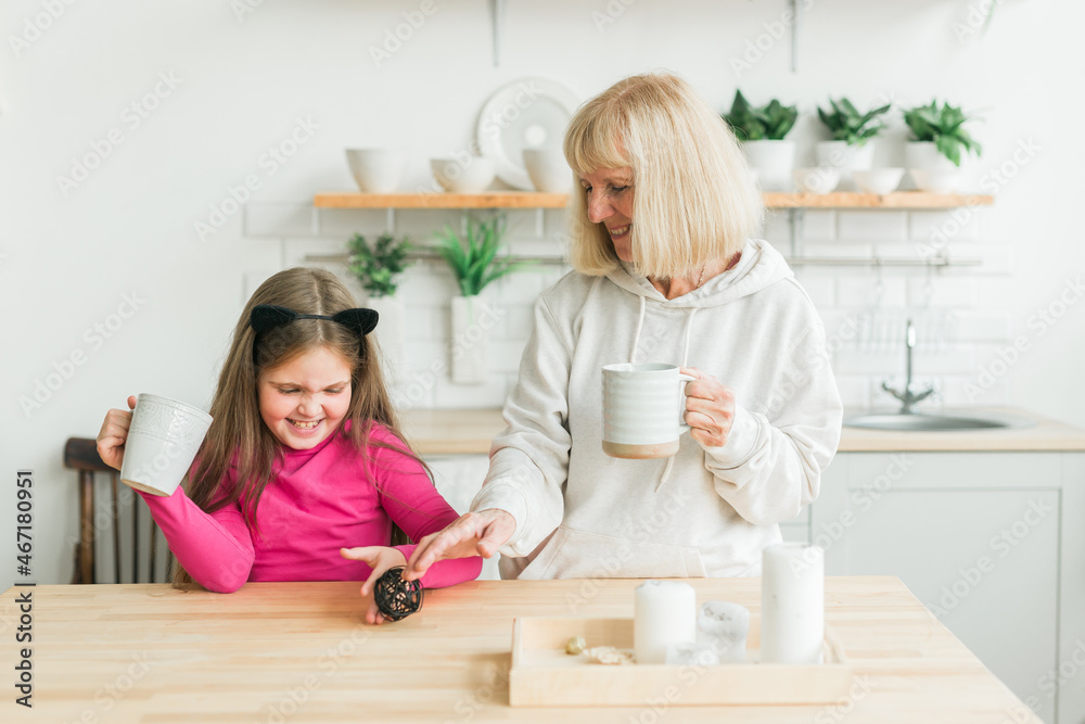 Grandmother and granddaughter having fun together at home. Generation and family concept Grandmother and granddaughter having fun together at home. Generation and family concept