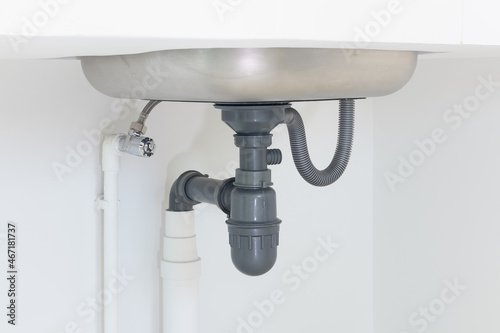 Foto Drain pipe or sewer under kitchen sink