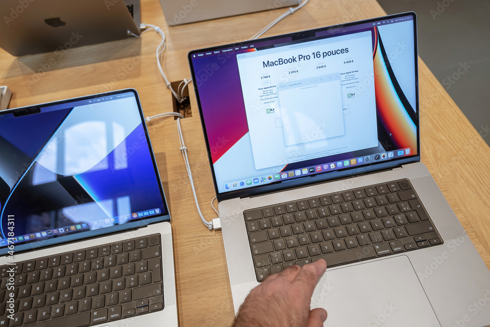 Paris; France - Sep 24; 2021: Male hand testing new Apple Computers ...
