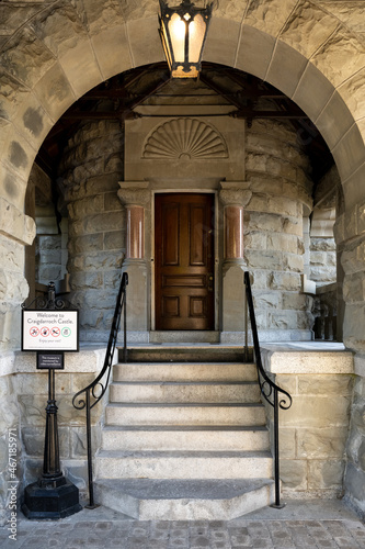 Vertical shot of an entrance door to the famous historic Craigdarroch Castle in Victoria photo