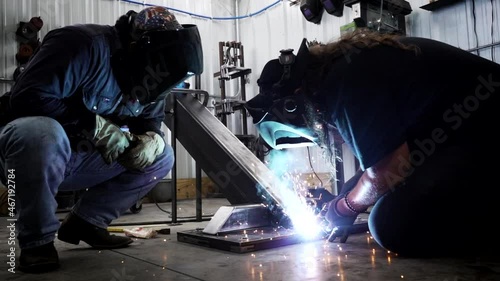 Men Welding Together on Steel Slow Motion 4K
