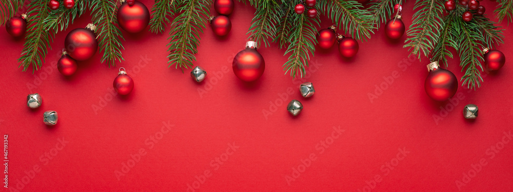 Christmas banner with fir branches and decorations on red background. Christmas banner with fir branches and decorations on red background.
