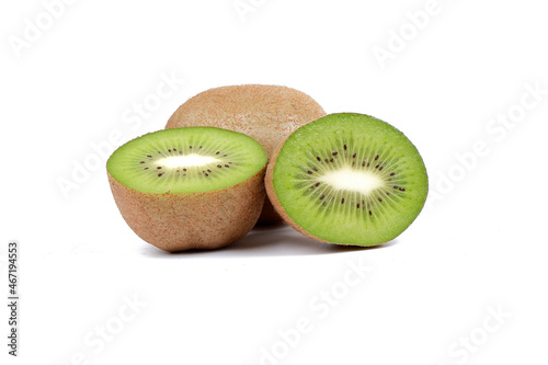 ripe kiwi fruits and kiwi halves isolated on a white background