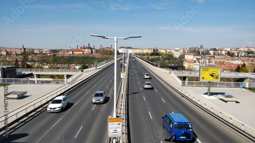 Big road bridge going into the Prague city center seeing from bridge surpassing the road.