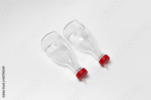 Glass oil dispenser bottles with pourer isolated on white background.High-resolution photo.