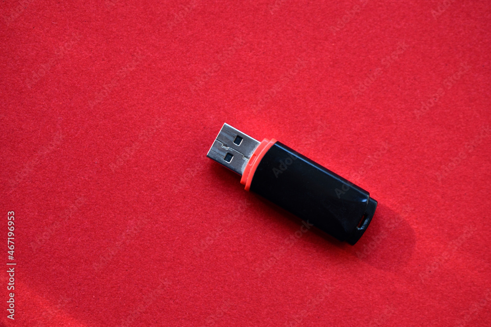 USB flash drive on a red velvet background USB flash drive on a red velvet background