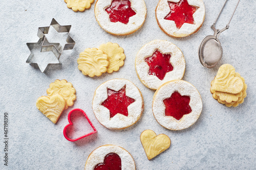 Classic Linzer Christmas Cookies with raspberry or strawberry jam on light background. photo