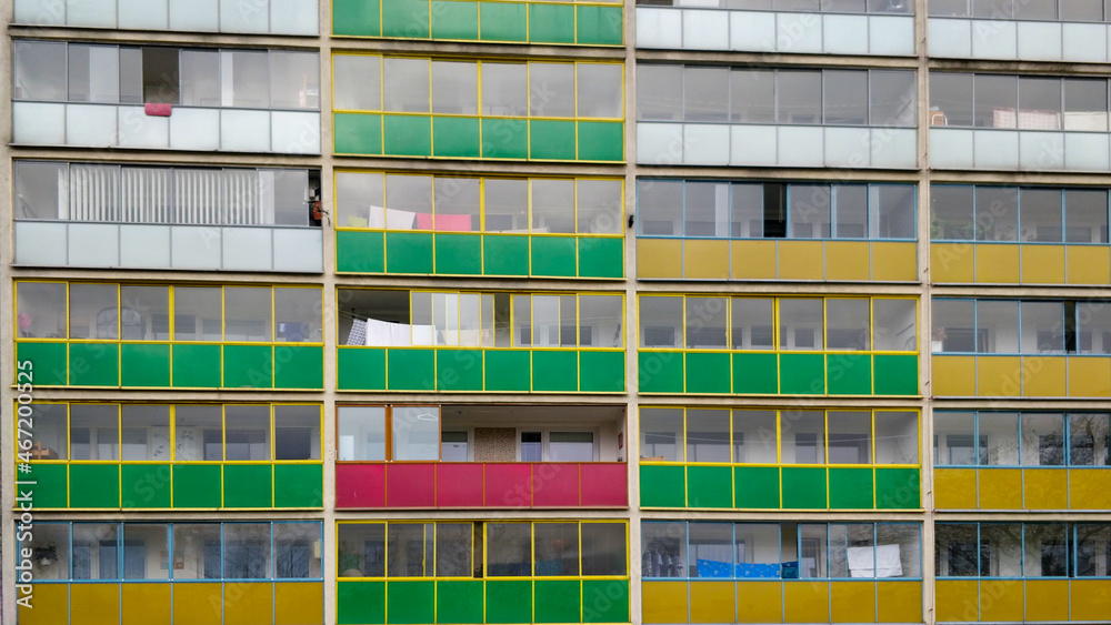 Colorful balconies in communist like old style block of flats. Some of the balconies are red, some green, some white and few of them are yellow. It's a typical view in such a residential area. Colorful balconies in communist like old style block of flats. Some of the balconies are red, some green, some white and few of them are yellow. It's a typical view in such a residential area.