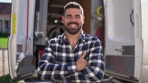 Portrait of an electrician happy worker at work photo