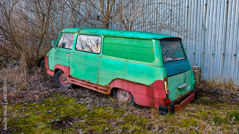 Old green wreck of vintage car.