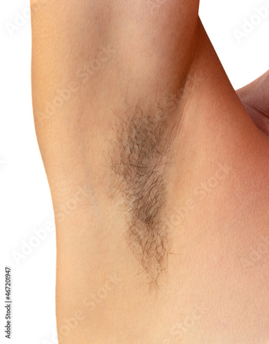 Canvas Print Isolated woman hairy unshaved armpit on the white background holding arm straigh