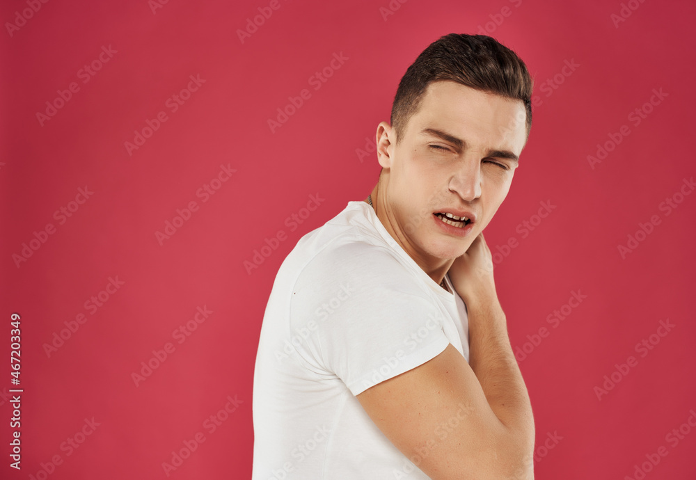 man in white t-shirt evolution posing studio pink background man in white t-shirt evolution posing studio pink background