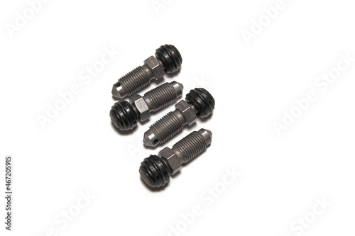 A set of brake bleeder screws on white background.