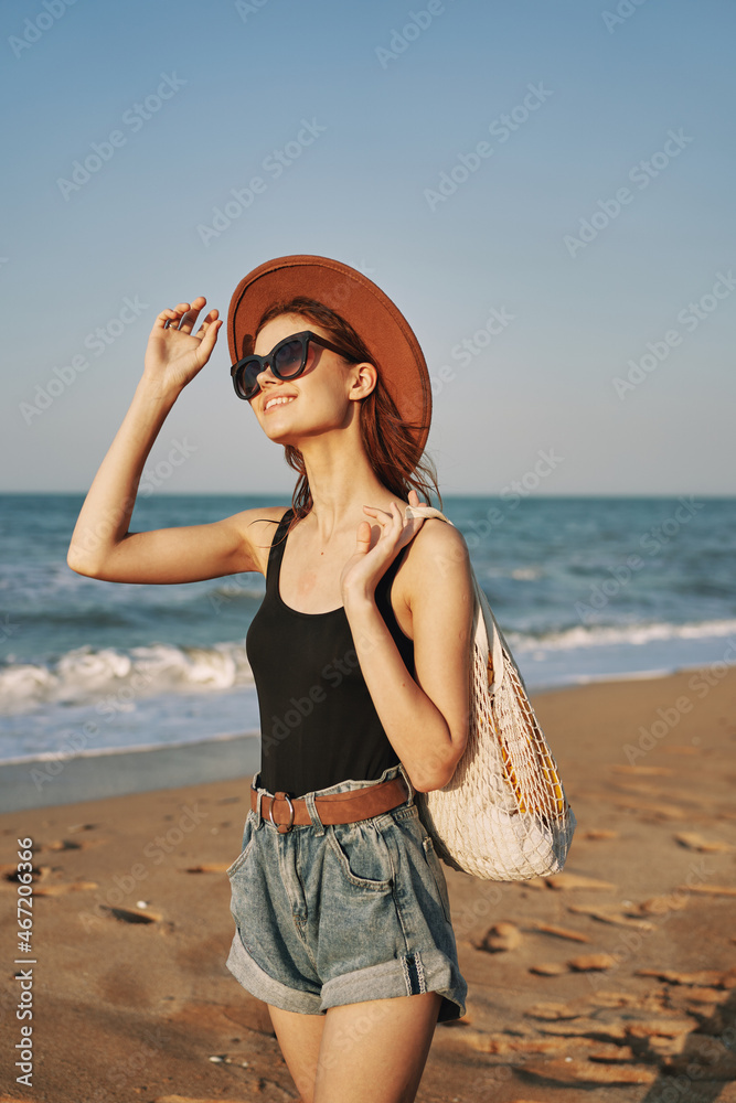 woman walking on the beach landscape sun fun lifestyle woman walking on the beach landscape sun fun lifestyle
