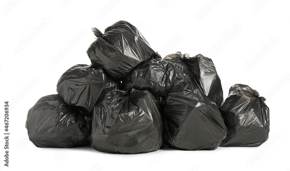 Black trash bags filled with garbage on white background