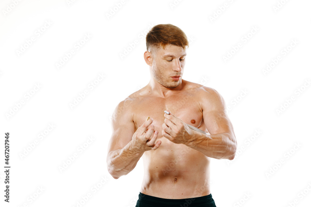 Fototapeta premium athletic man measures muscles fitness posing bodybuilder