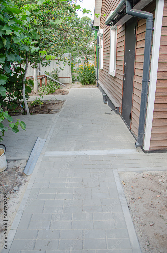 Fototapeta premium Perspective View Monotone Gray Brick Stone Pavement on The Ground for Street Road pattern