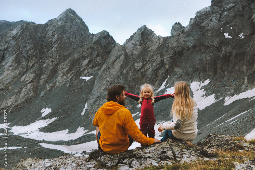 Child hiking with parents family travel vacations in mountains outdoor healthy lifestyle father and mother with baby daughter enjoying rocks view eco tourism