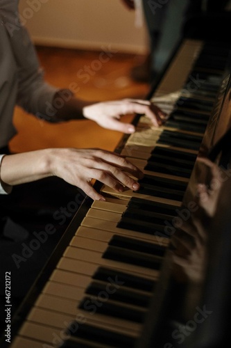 Cropped image of person playing the piano photo