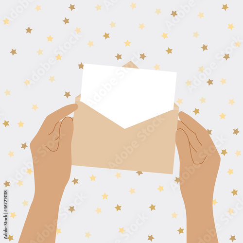 Human hands are holding an open envelope with a letter. Mail letter reading concept. Greeting card.