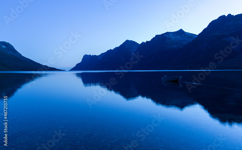 Lake near mountains under blue sky photo