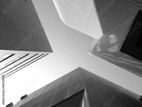 Low angle view of modern buildings in grayscale