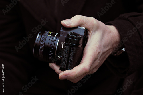 Person holding a camera photo