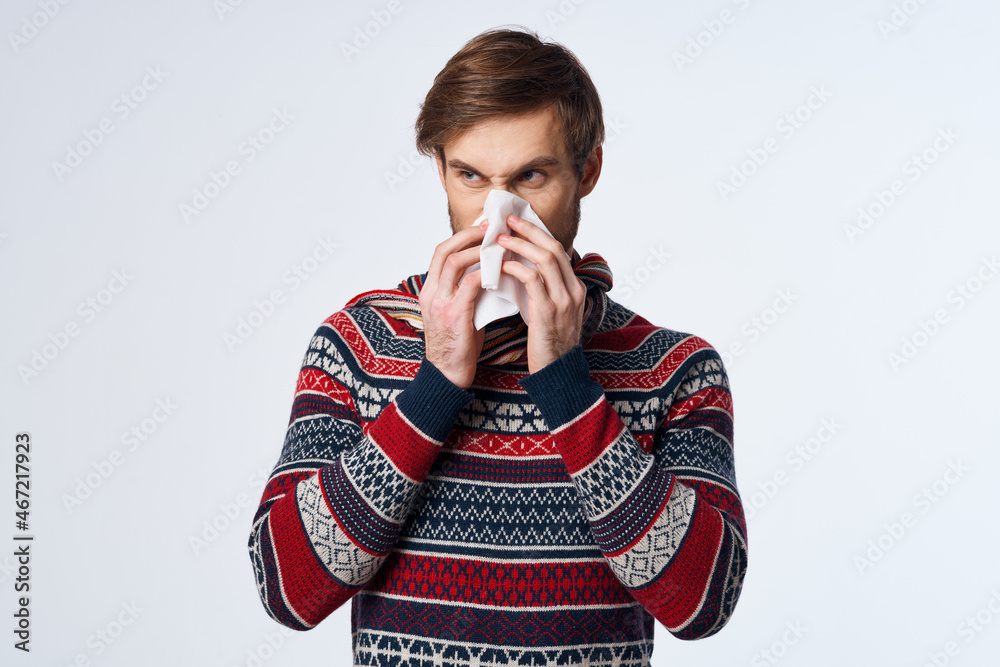 cold man with a handkerchief health problem flu symptoms light background cold man with a handkerchief health problem flu symptoms light background