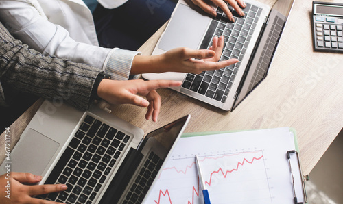 Two colleagues in an office discussing strategy