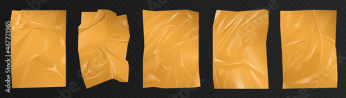 Golden crumpled polyethylene film set vector illustration. 3d realistic drapery of luxury gold plastic, paper or fabric silk with shiny silky surface, polyethylene mockup on transparent background