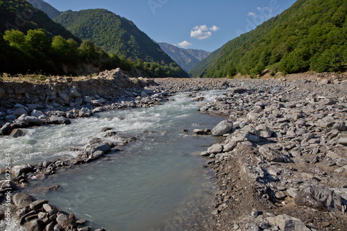 Mountain river valley landscape. Small lake made of riber stones within three months. Mountain river stream valley. River valley in mountains . stones a small river. Ismayilli Azerbaijan photo