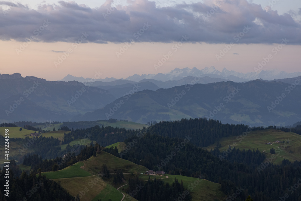 Obraz premium Amazing sunset at a wonderful landscape in Switzerland on a hill called Napf. Wonderful morning view with the alps in the horizon.