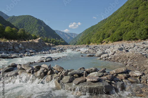 Mountain river valley landscape. Small lake made of riber stones within three months. Mountain river stream valley. River valley in mountains . stones a small river. Ismayilli Azerbaijan
