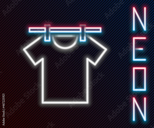 Glowing neon line Drying clothes icon isolated on black background. Clean shirt. Wash clothes on a rope with clothespins. Clothing care and tidiness. Colorful outline concept. Vector