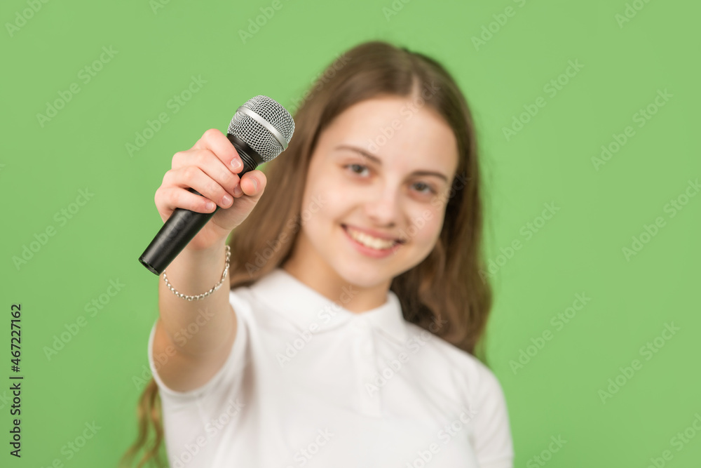microphone in hand of happy kid, selective focus, music microphone in hand of happy kid, selective focus, music