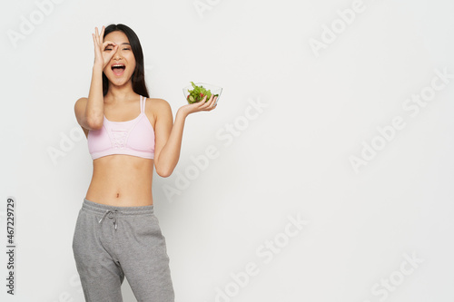 slender woman of asian appearance plate with salad diet © SHOTPRIME STUDIO