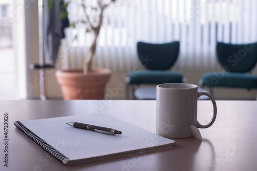 cup of tea with a pencil and note