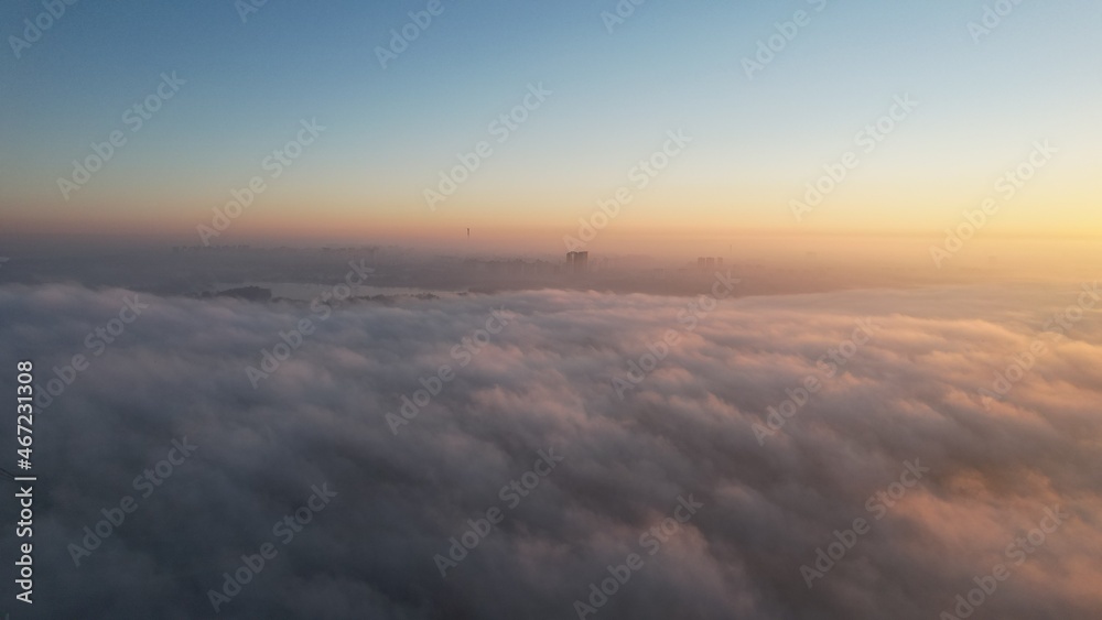 City in the fog on the sunrise 