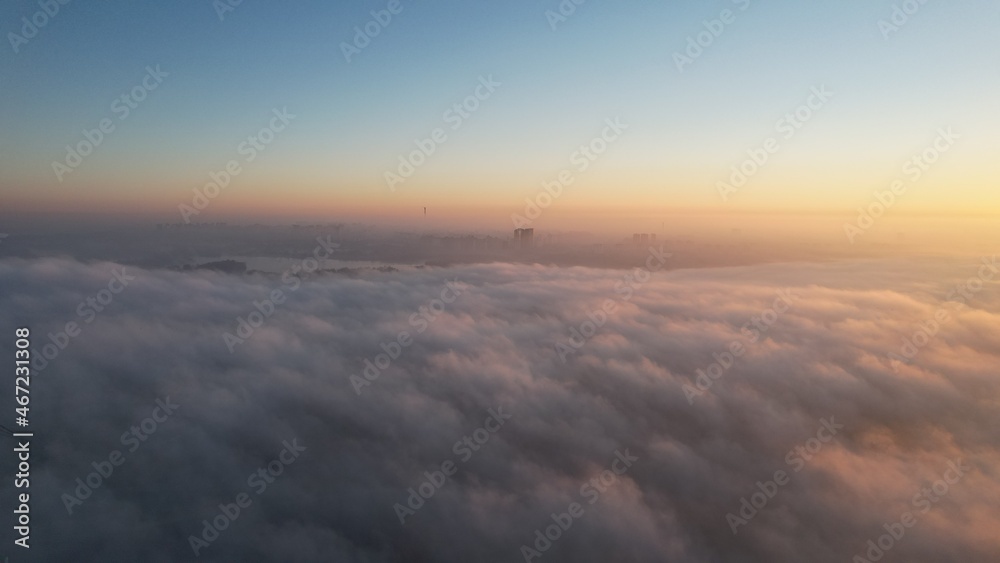 City in the fog on the sunrise City in the fog on the sunrise