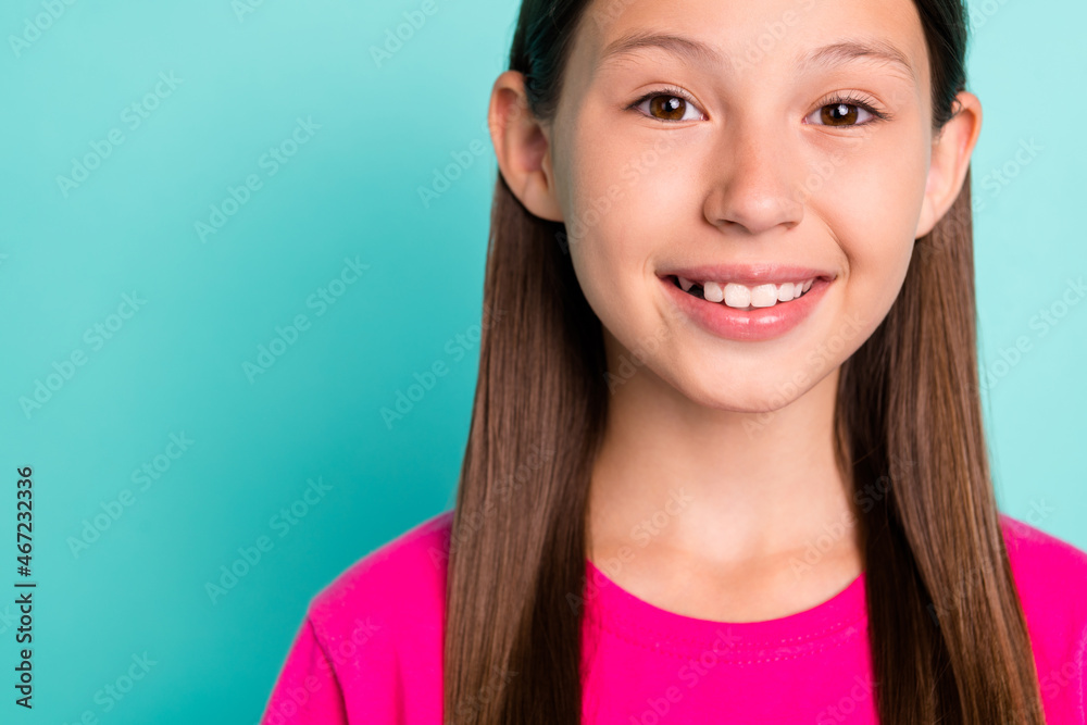 Cropped photo of positive happy cheerful small lady stand empty space weekend enjoy isolated on teal color background Cropped photo of positive happy cheerful small lady stand empty space weekend enjoy isolated on teal color background