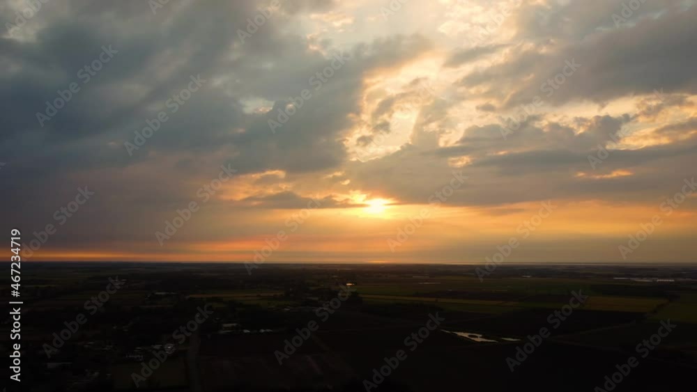 sunset over open English farmland sunset over open English farmland