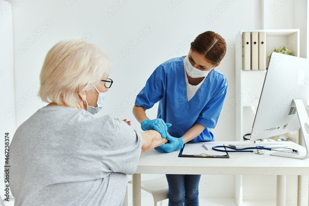 elderly woman and doctor examination medical office